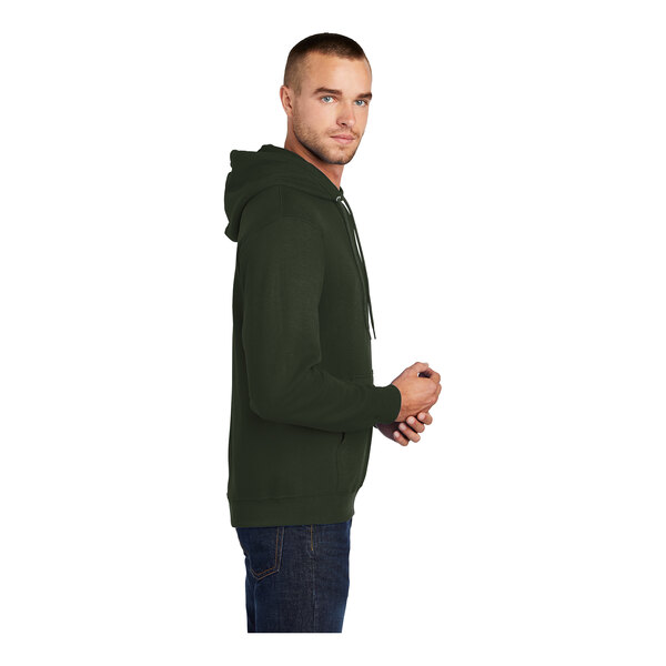 A man wearing an olive Port & Company core fleece pullover hoodie.