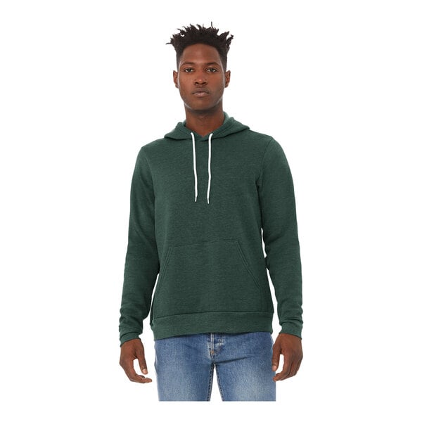 A man wearing a heather forest green Bella + Canvas sponge fleece pullover hoodie.