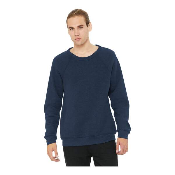 A man wearing a Bella + Canvas navy sponge fleece raglan sweatshirt.