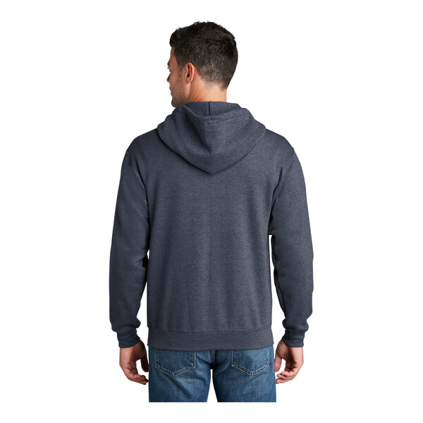 A man wearing a navy Port & Company Core Fleece full-zip hoodie.