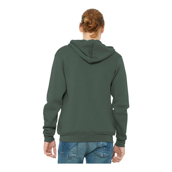 A woman wearing a military green Bella + Canvas full-zip hoodie.