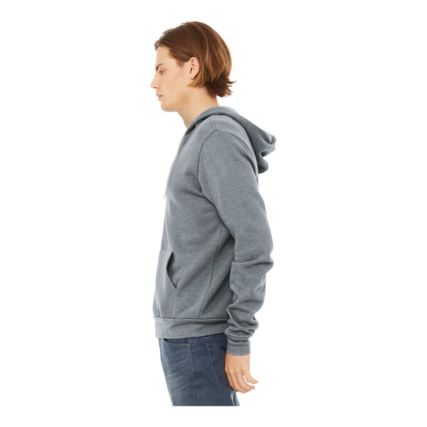 A person wearing a Bella + Canvas unisex grey Sponge Fleece hoodie.