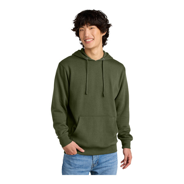 A man wearing a green District hoodie.