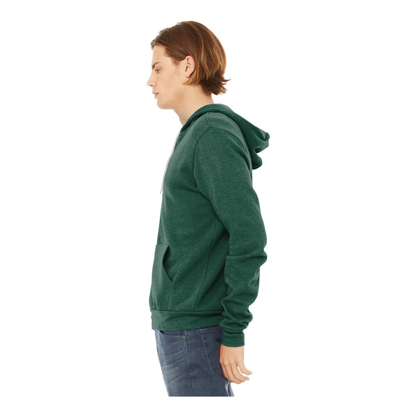 A person wearing a Bella + Canvas heather forest green full-zip hoodie.