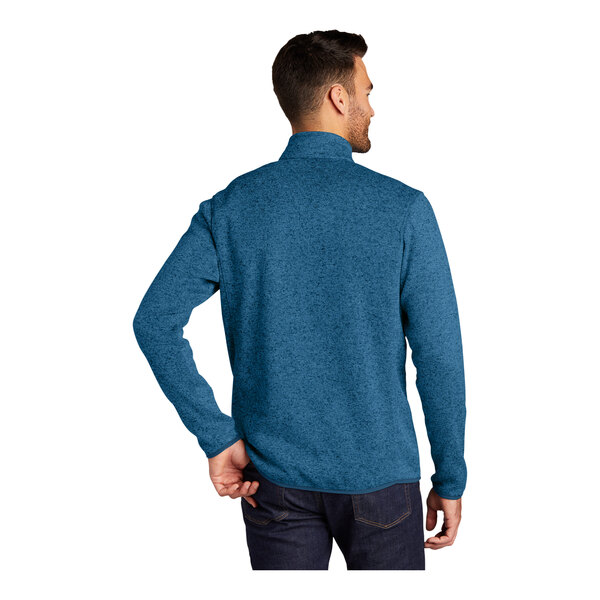 A man wearing a blue Port Authority fleece sweater jacket.