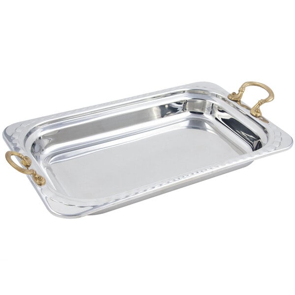 A silver Bon Chef rectangular food pan with curved arches and round brass handles.