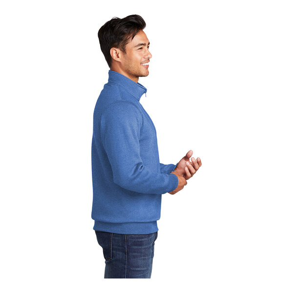 A man wearing a Port & Company heather royal blue quarter-zip pullover.