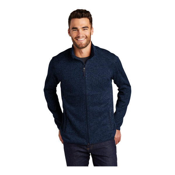 A man wearing a Port Authority River Blue fleece sweater jacket with a Navy Heather design.
