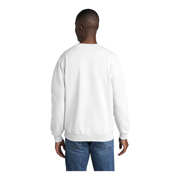 A man wearing a white Port & Company core fleece sweatshirt.