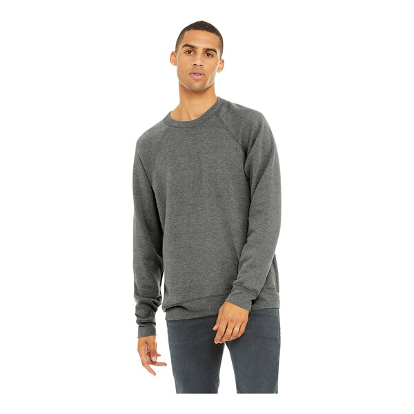 A man wearing a Bella + Canvas grey triblend raglan sweatshirt.
