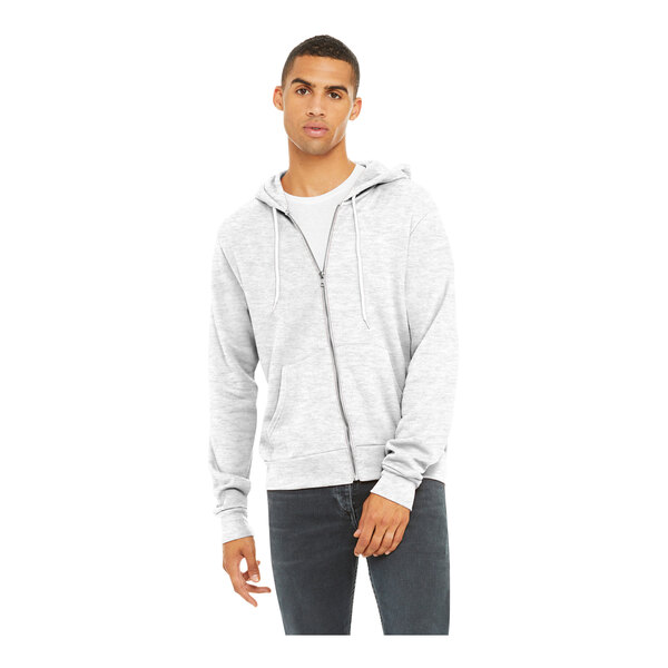 A man wearing a Bella + Canvas ash grey full-zip hoodie.