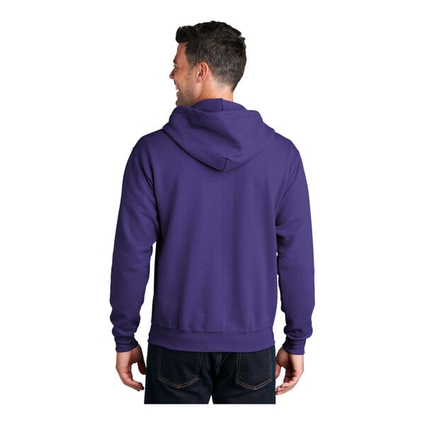 A man wearing a purple Port & Company full-zip hoodie.