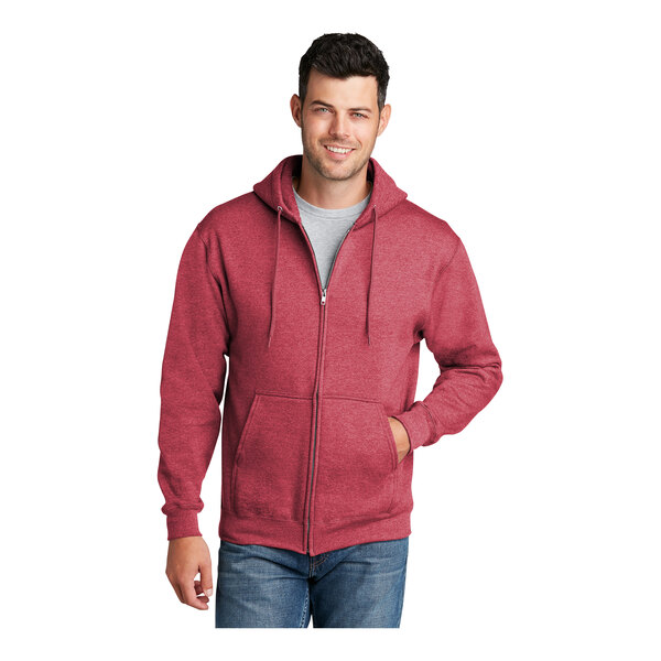 A man wearing a red Port & Company full-zip hoodie.