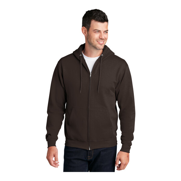 A man wearing a Port & Company brown full-zip hoodie.