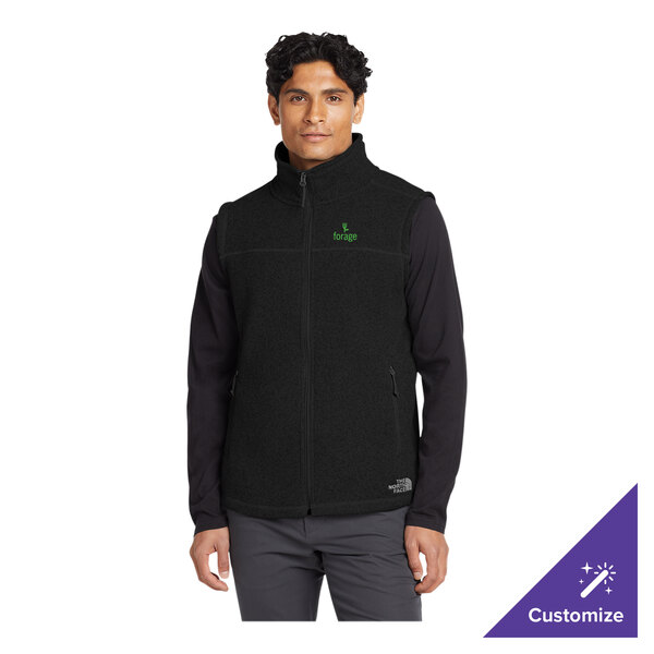 A unisex black heather fleece sweater vest by The North Face, shown in size 3X.