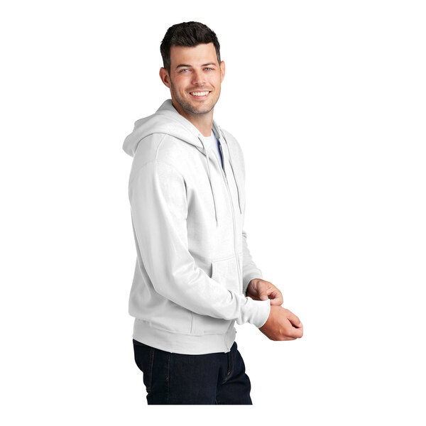 A man wearing a white Port & Company full-zip hoodie.