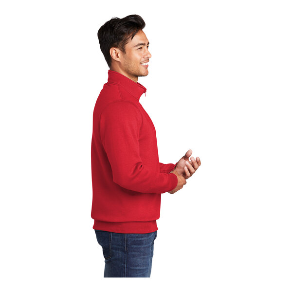 A man wearing a red Port & Company quarter-zip fleece sweatshirt.