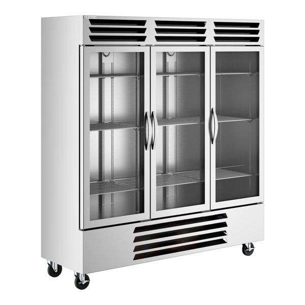 A large commercial glass door reach-in freezer with three sections and stainless steel exterior.