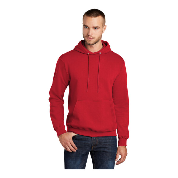 A man wearing a red Port & Company Core Fleece pullover hoodie.