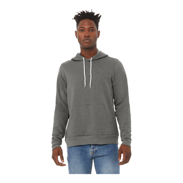 A man wearing a Bella + Canvas deep heather grey pullover hoodie.