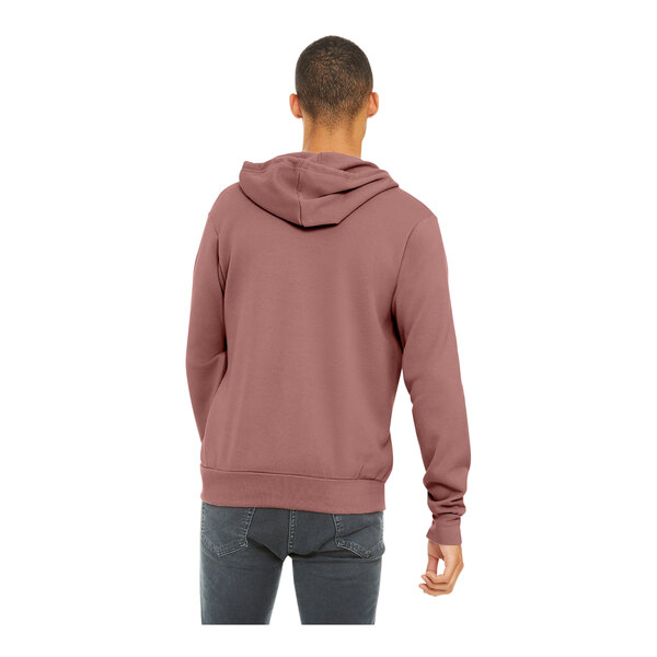 A man wearing a mauve Bella + Canvas full-zip hoodie.