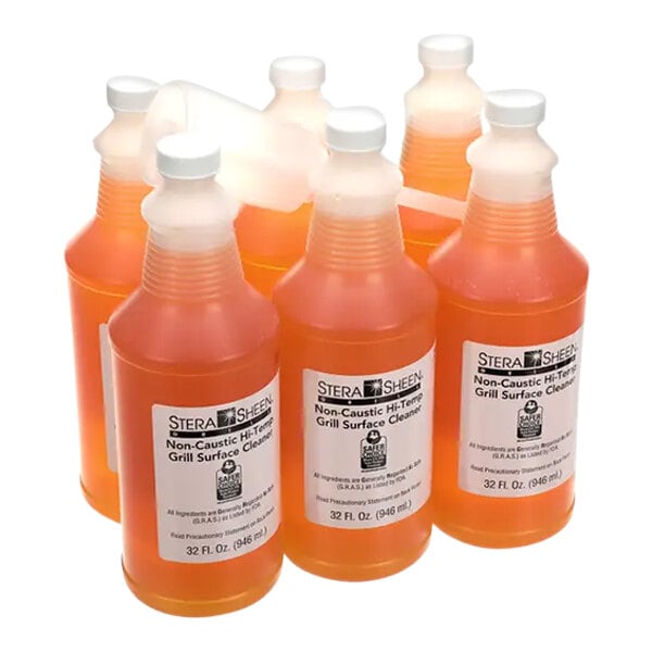 A close-up of a group of Taylor Stera Sheen grill surface cleaner bottles.