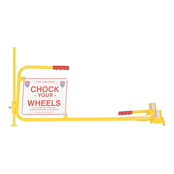 A yellow steel rail chock with a yellow sign and red handles.