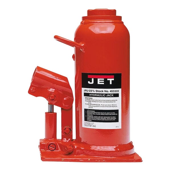 A red JET hydraulic bottle jack with a black label and handle.