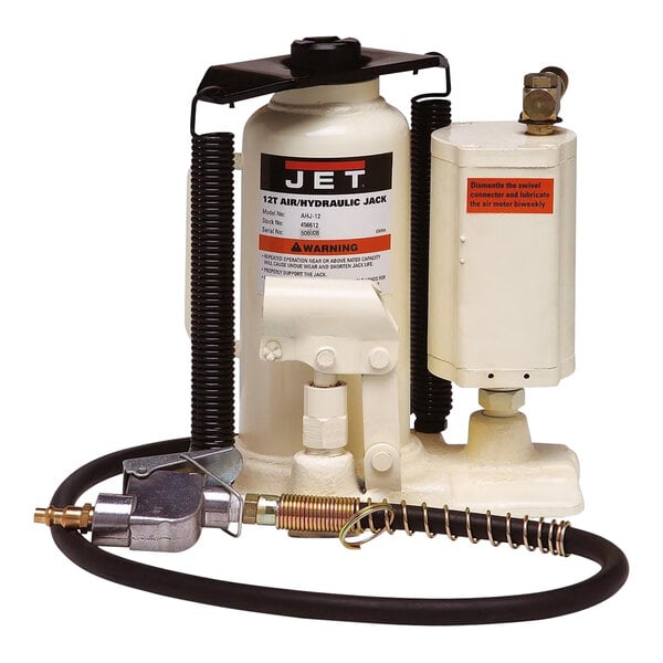 A white JET air/hydraulic bottle jack with a black and red label and a black handle attached to a hose.