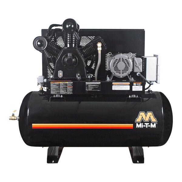 A black air compressor with a hose attached.
