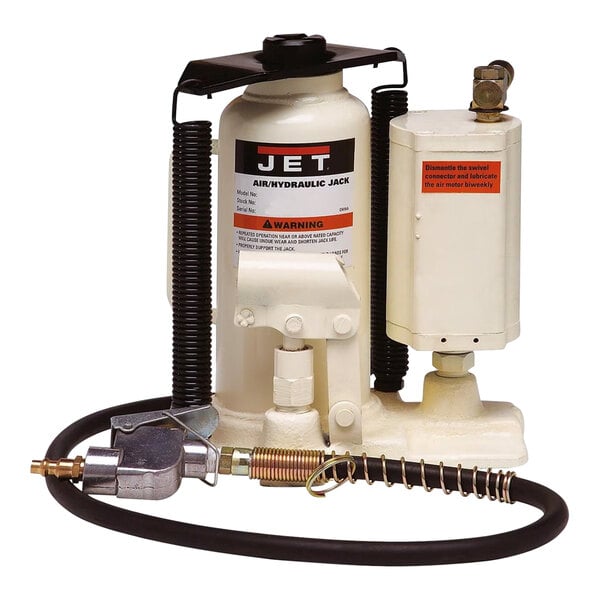 A white JET air/hydraulic bottle jack with a black hose.