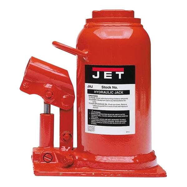 A red JET hydraulic bottle jack with a white label and handle.