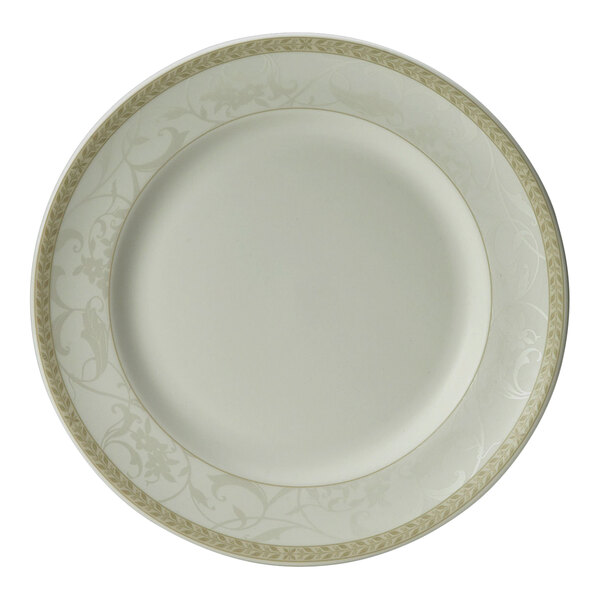 A close up of a Steelite Antoinette white plate with gold trim.
