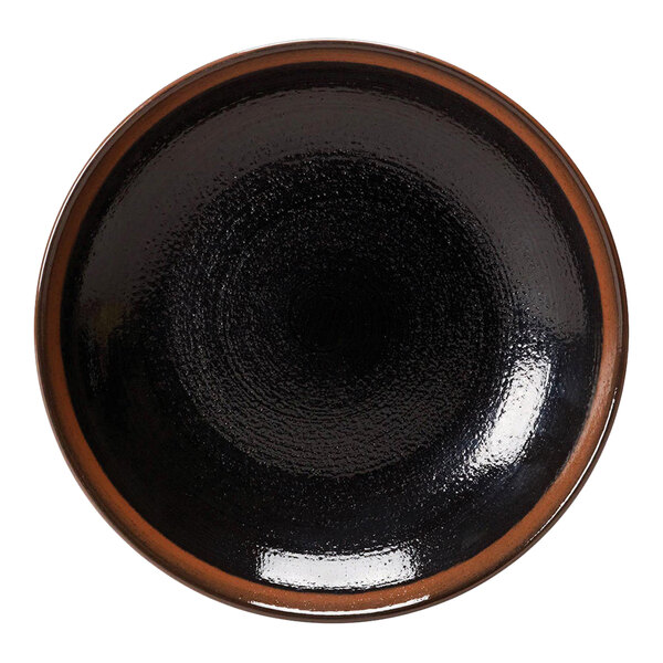 A black bowl with a brown rim.