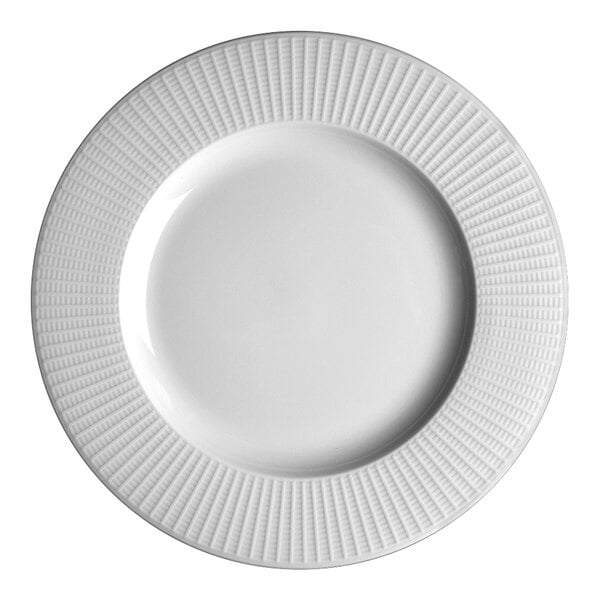 A Steelite white china plate with a wavy pattern on the rim.