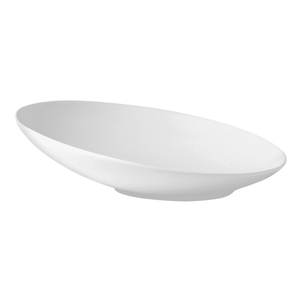 A white oval shaped plate with a curved edge.