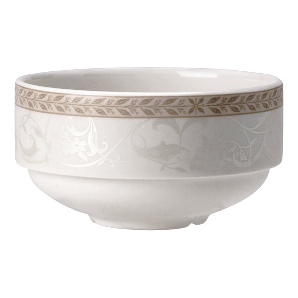 A close up of a Steelite Antoinette white bowl with gold designs.