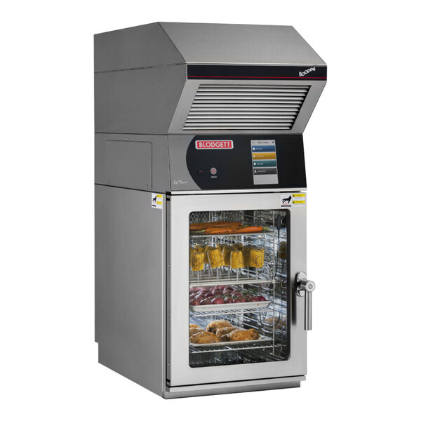 A Blodgett mini electric combi oven with a door open over trays of food.