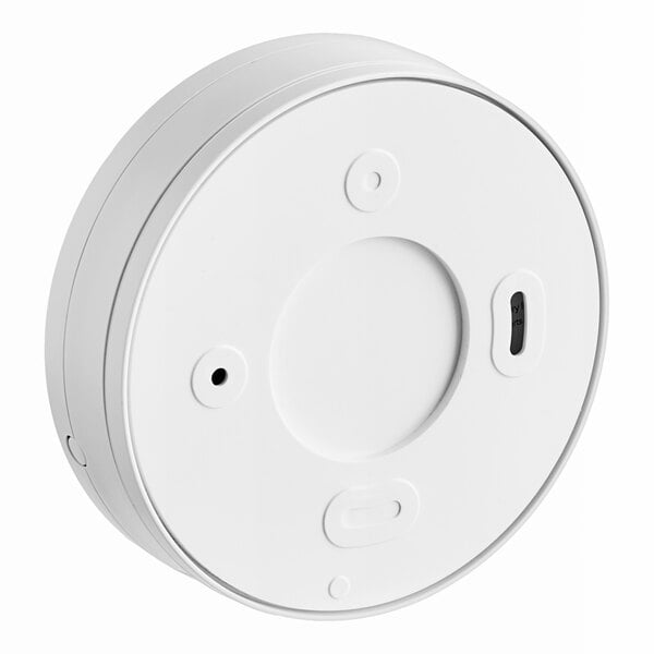 A round white Kidde smoke alarm with a button in the center