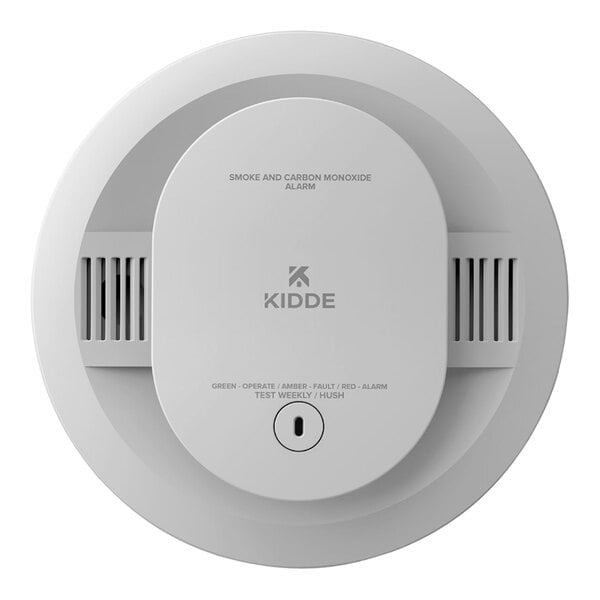 A close up of a Kidde white circular smoke and carbon monoxide detector with a blue button.