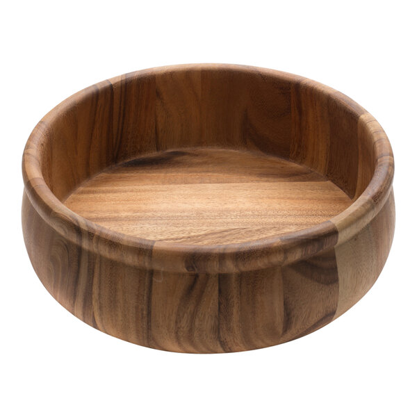 An Ironwood acacia wood salad bowl with beadrim on a table.