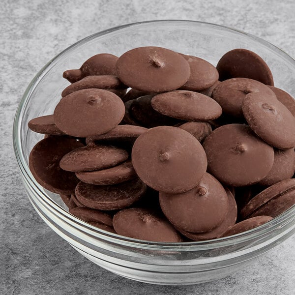 A bowl of chocolate-covered cookies with Ghirardelli dark coating.