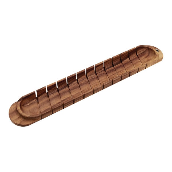 An Ironwood Acacia wood board with many holes for French bread.