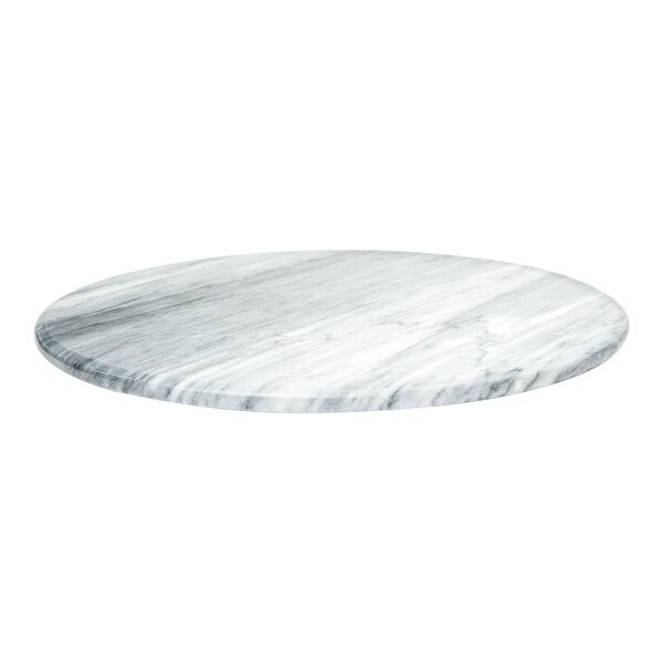 An Ironwood white marble Lazy Susan on a table with a white surface.