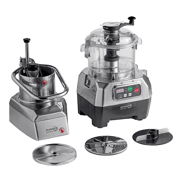 A commercial combination food processor with a clear plastic bowl, continuous feed attachment, and multiple discs for slicing and chopping.