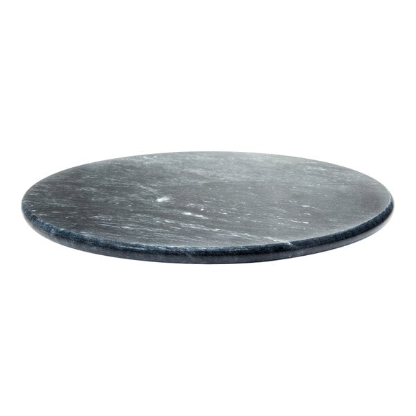 An Ironwood black marble Lazy Susan on a table.