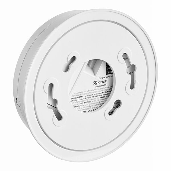 A white circular Kidde smoke alarm with holes in it.