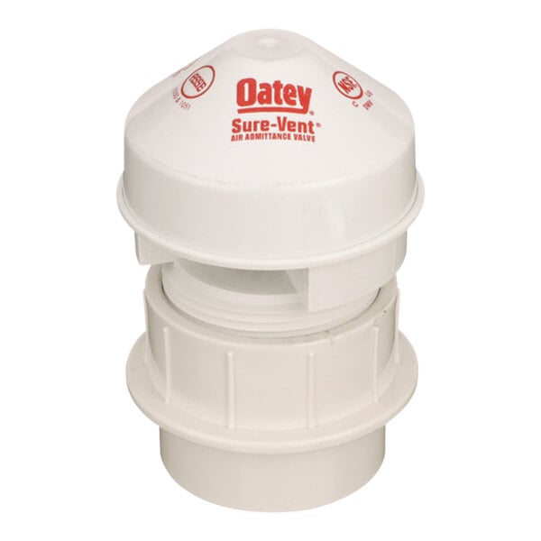 A white plastic Oatey adapter with red text.