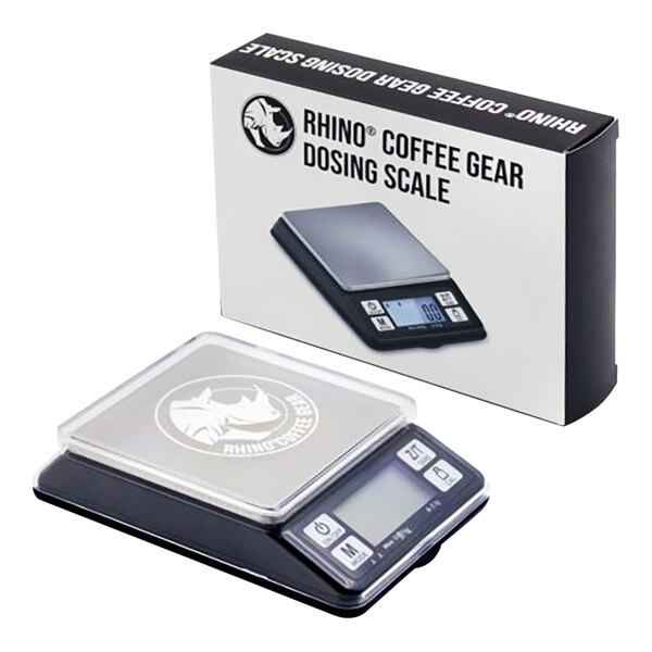 A black and white Rhino Coffee Gear dosing coffee scale on a counter with a box showing coffee gear.