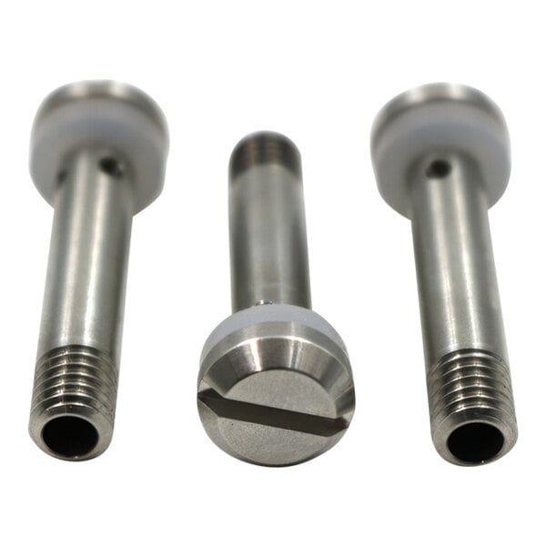 A close-up of a metal cylinder with three stainless steel bolts and nuts.